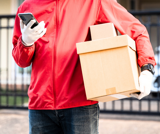 Photo of man holding parcel